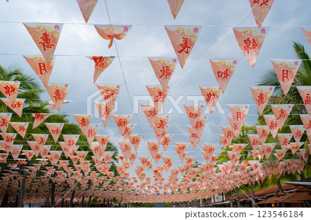Vibrant and Colorful Festival Decorations Exposed Under a Cloudy Sky During the Event Vibrant and Colorful Festival Decorations Exposed Under a Cloudy Sky During the Event 123546184