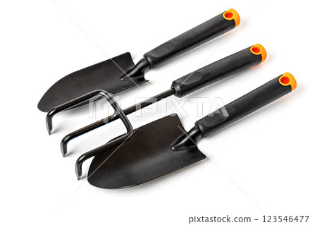 Gardening tools set with trowel, hand rake and cultivator lying on white background Gardening tools set with trowel, hand rake and cultivator lying on white background 123546477