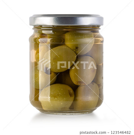 Glass jar preserving pickled green olives on white background Glass jar preserving pickled green olives on white background 123546482