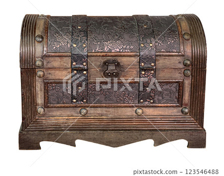 Closed wooden hope chest displaying floral metal decoration and rivets 123546488