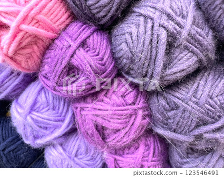 Colorful yarn balls forming a cozy pile for knitting and crochet Colorful yarn balls forming a cozy pile for knitting and crochet 123546491