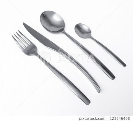 Fork, knife, and spoons creating modern cutlery set on white background 123546498