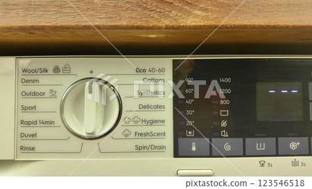 A view of the control panel of a modern washing machine. The operating panel of a washing machine. The concept of housework. Home washing concept 123546518