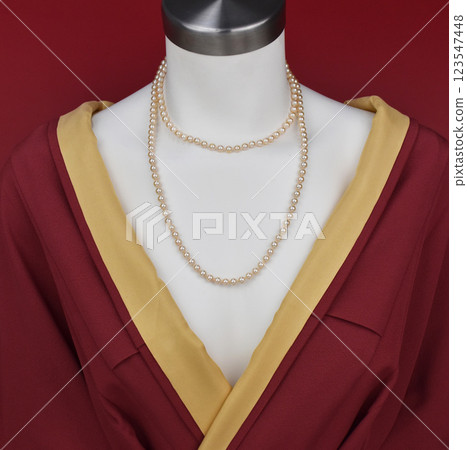 Unique necklace on a white mannequin, promotional photo for an online vintage and handmade jewelry store Unique necklace on a white mannequin, promotional photo for an online vintage and handmade jewelry store 123547448