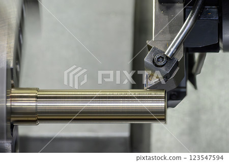 The CNC lathe machine forming cutting the metal shaft parts. 123547594