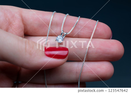 Unique necklace for women on a black background, promotional photo for an online vintage and handmade jewelry store  123547642