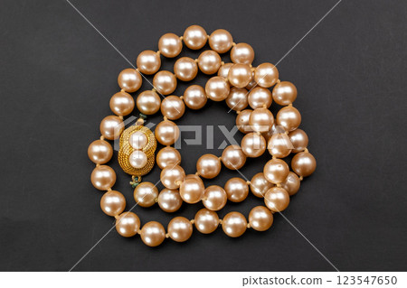 Unique necklace for women on a black background, promotional photo for an online vintage and handmade jewelry store Unique necklace for women on a black background, promotional photo for an online vintage and handmade jewelry store 123547650