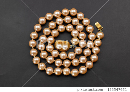 Unique necklace for women on a black background, promotional photo for an online vintage and handmade jewelry store Unique necklace for women on a black background, promotional photo for an online vintage and handmade jewelry store 123547651