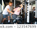 Woman doing muscle training at the gym 123547699