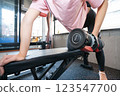 Woman doing muscle training at the gym 123547700