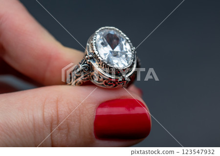 Statement ring for women on a black background, fine jewelry concept,  promotional photo for an online vintage and handmade jewelry store 123547932