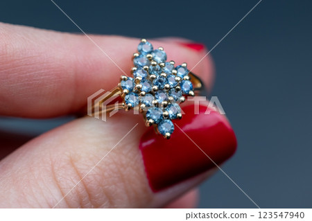 Statement ring for women on a black background, fine jewelry concept,  promotional photo for an online vintage and handmade jewelry store 123547940