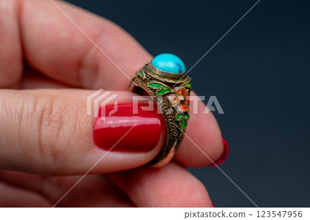 Statement ring for women on a black background, fine jewelry concept,  promotional photo for an online vintage and handmade jewelry store 123547956