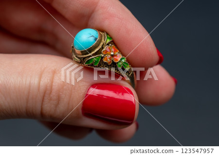 Statement ring for women on a black background, fine jewelry concept,  promotional photo for an online vintage and handmade jewelry store 123547957