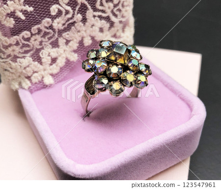Statement ring for women on a black background, fine jewelry concept,  promotional photo for an online vintage and handmade jewelry store 123547961