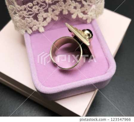 Statement ring for women on a black background, fine jewelry concept,  promotional photo for an online vintage and handmade jewelry store 123547966