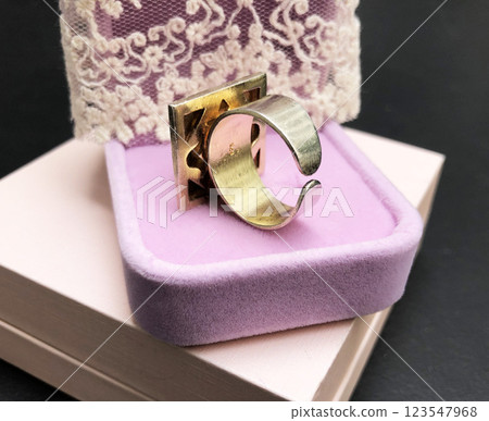 Statement ring for women on a black background, fine jewelry concept, promotional photo for an online vintage and handmade jewelry store Statement ring for women on a black background, fine jewelry concept, promotional photo for an online vintage and handmade jewelry store 123547968