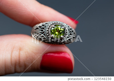 Statement ring for women on a black background, fine jewelry concept,  promotional photo for an online vintage and handmade jewelry store 123548150