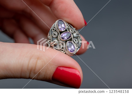 Statement ring for women on a black background, fine jewelry concept, promotional photo for an online vintage and handmade jewelry store Statement ring for women on a black background, fine jewelry concept, promotional photo for an online vintage and handmade jewelry store 123548158