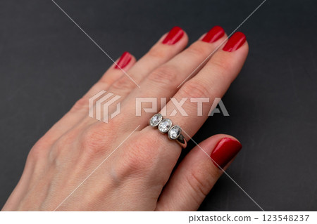 Statement ring for women on a black background, fine jewelry concept,  promotional photo for an online vintage and handmade jewelry store 123548237
