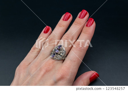 Statement ring for women on a black background, fine jewelry concept, promotional photo for an online vintage and handmade jewelry store Statement ring for women on a black background, fine jewelry concept, promotional photo for an online vintage and handmade jewelry store 123548257