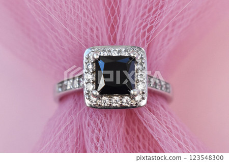 Statement ring for women on a pink background, fine jewelry concept,  promotional photo for an online vintage and handmade jewelry store 123548300