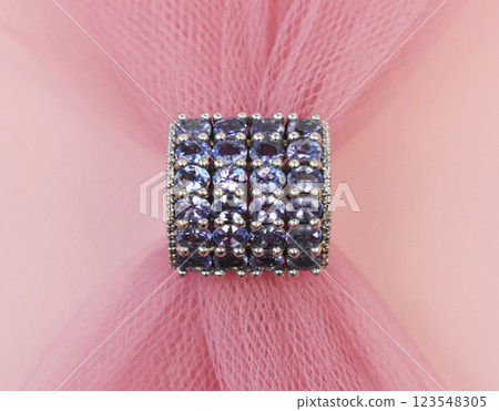Statement ring for women on a pink background, fine jewelry concept, promotional photo for an online vintage and handmade jewelry store Statement ring for women on a pink background, fine jewelry concept, promotional photo for an online vintage and handmade jewelry store 123548305