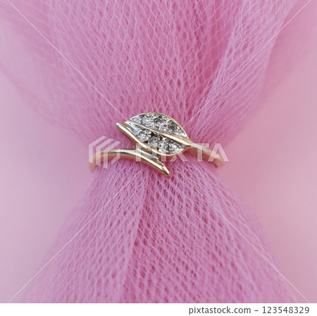 Statement ring for women on a pink background, fine jewelry concept,  promotional photo for an online vintage and handmade jewelry store 123548329