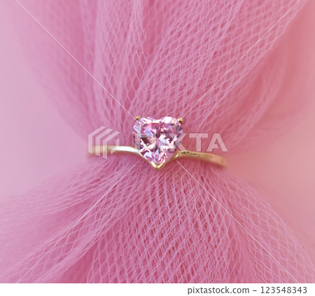 Statement ring for women on a pink background, fine jewelry concept, promotional photo for an online vintage and handmade jewelry store Statement ring for women on a pink background, fine jewelry concept, promotional photo for an online vintage and handmade jewelry store 123548343