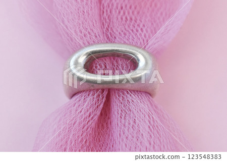 Statement ring for women on a pink background, fine jewelry concept,  promotional photo for an online vintage and handmade jewelry store 123548383