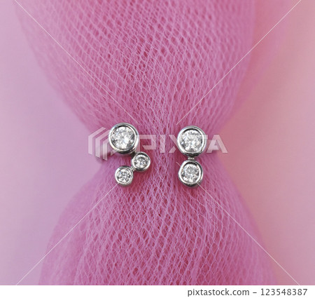 Statement ring for women on a pink background, fine jewelry concept, promotional photo for an online vintage and handmade jewelry store Statement ring for women on a pink background, fine jewelry concept, promotional photo for an online vintage and handmade jewelry store 123548387