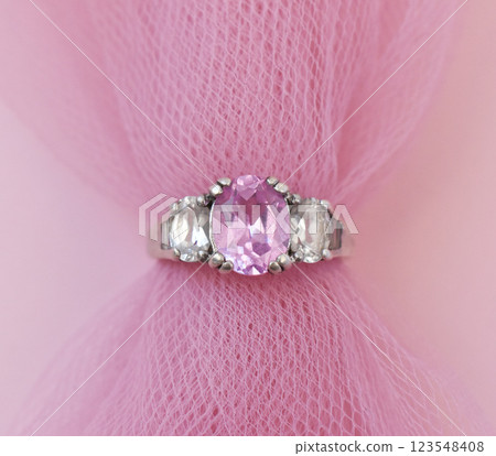 Statement ring for women on a pink background, fine jewelry concept,  promotional photo for an online vintage and handmade jewelry store 123548408