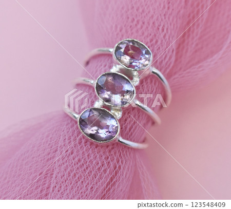 Statement ring for women on a pink background, fine jewelry concept,  promotional photo for an online vintage and handmade jewelry store 123548409