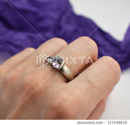 Statement ring for women on a purple background, fine jewelry concept,  promotional photo for an online vintage and handmade jewelry store 123548619