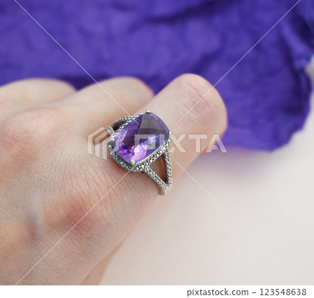Statement ring for women on a purple background, fine jewelry concept, promotional photo for an online vintage and handmade jewelry store Statement ring for women on a purple background, fine jewelry concept, promotional photo for an online vintage and handmade jewelry store 123548638