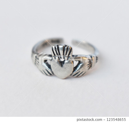 Statement ring for women on a white background, fine jewelry concept, promotional photo for an online vintage and handmade jewelry store Statement ring for women on a white background, fine jewelry concept, promotional photo for an online vintage and handmade jewelry store 123548655