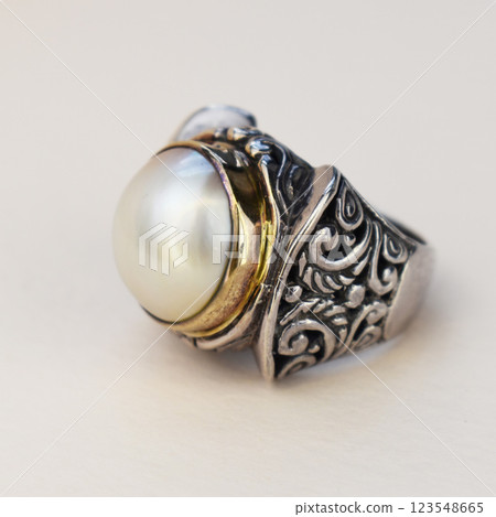 Statement ring for women on a white background, fine jewelry concept, promotional photo for an online vintage and handmade jewelry store Statement ring for women on a white background, fine jewelry concept, promotional photo for an online vintage and handmade jewelry store 123548665