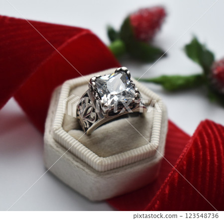 Statement ring for women on a white background, fine jewelry concept, promotional photo for an online vintage and handmade jewelry store Statement ring for women on a white background, fine jewelry concept, promotional photo for an online vintage and handmade jewelry store 123548736