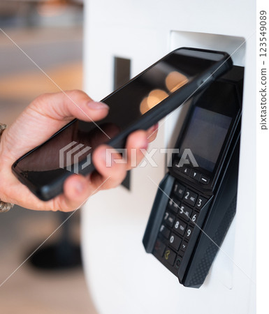 Customer Using Smartphone To Contactless Payment In Shop Customer Using Smartphone To Contactless Payment In Shop 123549089