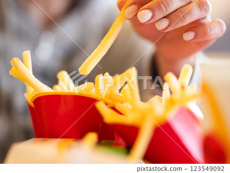 Girl Eating French Fries Girl Eating French Fries 123549092