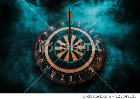 Dart Arrow Hitting the Center of a Dartboard with Smoky Background for Business Concept Image 123549135