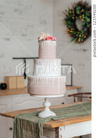 fake pink cake on wooden table. plastic cake for children photo shoots fake pink cake on wooden table. plastic cake for children photo shoots 123549200