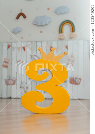 yellow number three on the background of children's stickers. children's photo zone for birthday 123549203