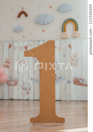 cork number one on the background of children's stickers. children's photo zone boy's first birthday 123549204