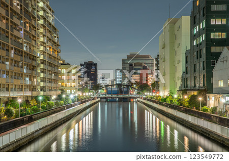 A river flowing in the city at night 123549772