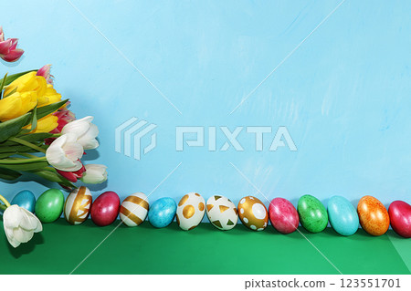Decorated golden eggs on a trendy blue background. Minimal holiday concept. Happy Easter background, place for text, postcard, banner for the screen. Decorated golden eggs on a trendy blue background. Minimal holiday concept. Happy Easter background, place for text, postcard, banner for the screen. 123551701