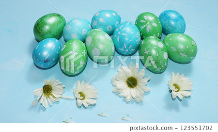 Decorated golden eggs on a trendy blue background. Minimal holiday concept. Happy Easter background, place for text, postcard, banner for the screen. Decorated golden eggs on a trendy blue background. Minimal holiday concept. Happy Easter background, place for text, postcard, banner for the screen. 123551702