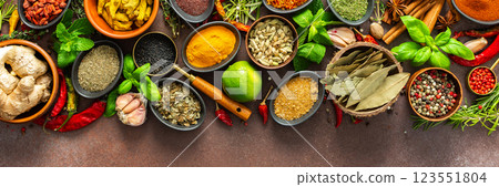 A rich palette of colorful spices and herbs, resting on a brown background, radiating freshness and an inviting aroma, perfect for gourmet inspiration, banner A rich palette of colorful spices and herbs, resting on a brown background, radiating freshness and an inviting aroma, perfect for gourmet inspiration, banner 123551804