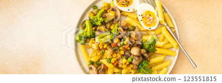 Pasta with fried mushrooms and broccoli, green peas and corn, fresh mix salad Pasta with fried mushrooms and broccoli, green peas and corn, fresh mix salad 123551815