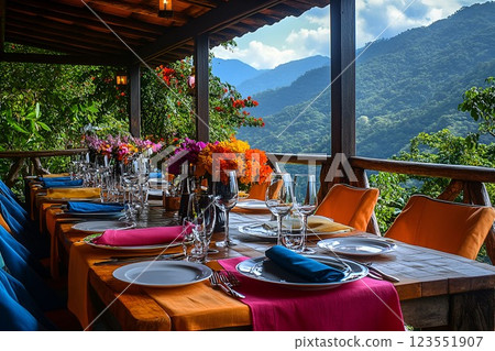 Elegant outdoor dining with colorful table setting and mountain view 123551907